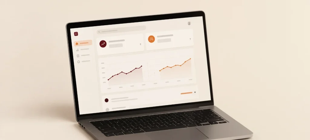 A laptop showing a growth dashboard with two trend charts